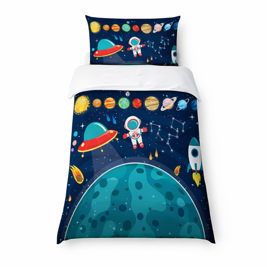 Space astronaut single duvet set with planets, rocket and UFO on dark navy starry background displayed on a child’s bed on a white background