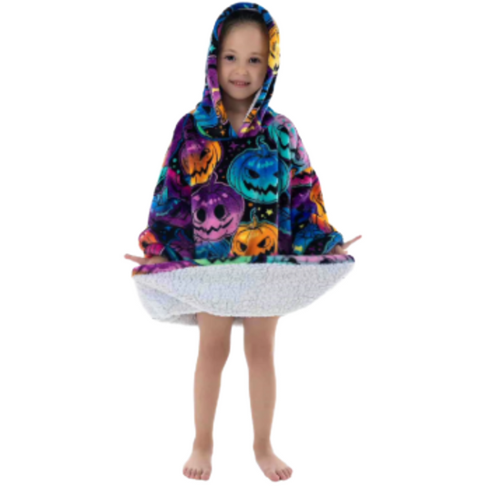 Child wearing colourful oversized wearable hoodie with jack-o-lantern print and soft sherpa lining