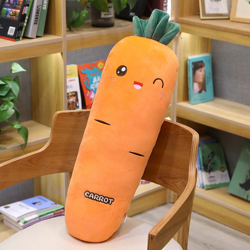 Long carrot plush sleeping companion pillow with smiling face and soft green leaf detail