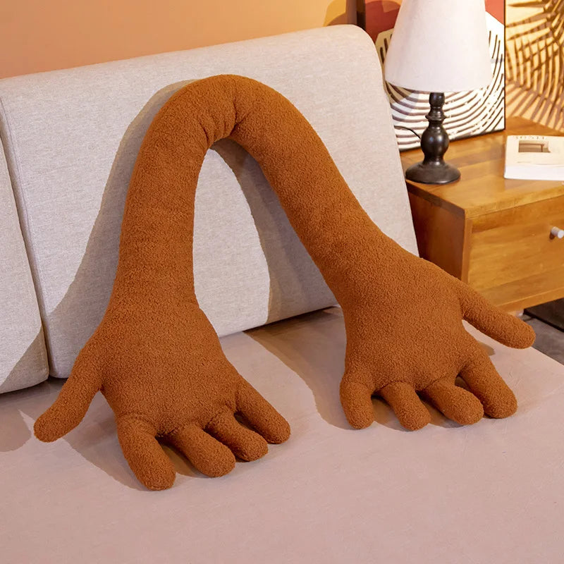 Brown soft plush simulation hand on a couch.
