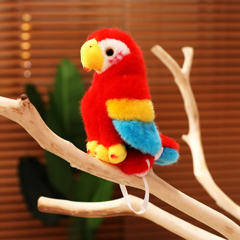 Red plush parrot toy on a branch with a blurred plant and wooden background