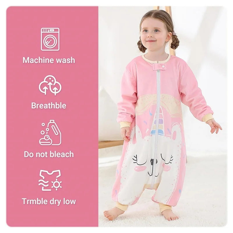 Child wearing a pink unicorn-themed onesie with care instructions on a pink background