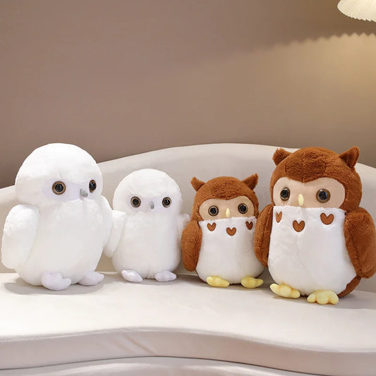 Four owl-themed plush toys on a white surface with a neutral background
