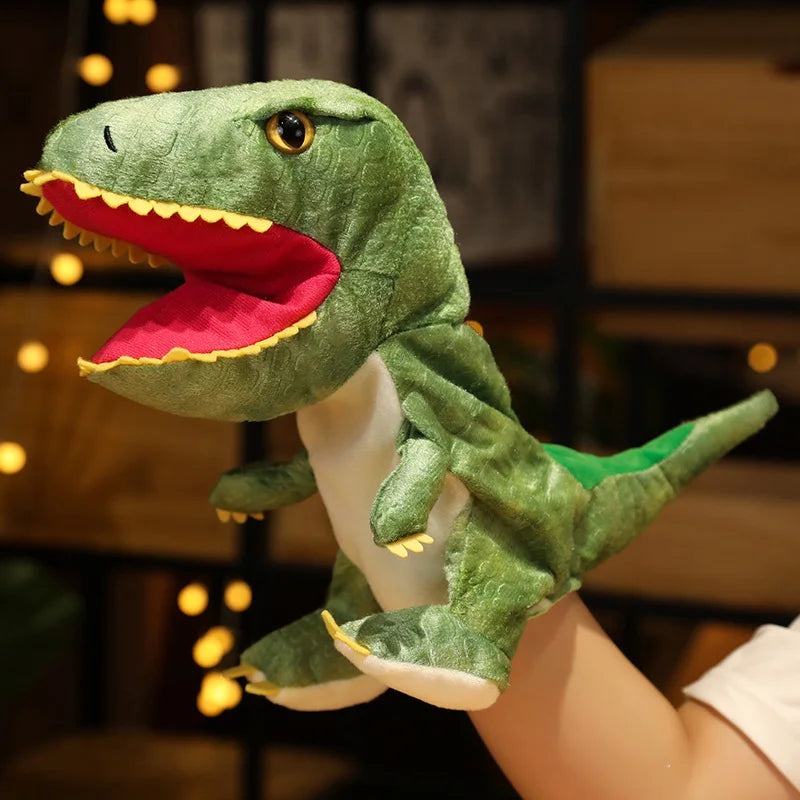 Green dinosaur plush hand puppet held in a hand with a blurred background