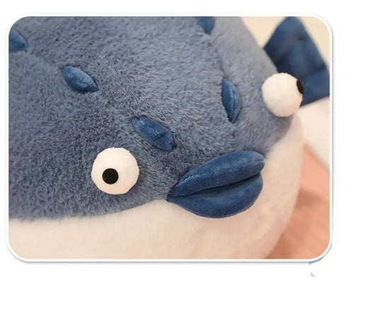 Close-up of a plush pufferfish toys detailing on the face.