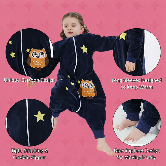Child wearing a navy blue onesie with owl design on a pink background with close up of features