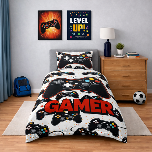 Bedroom with gaming-themed bedding featuring game controllers and 'Gamer' text.
