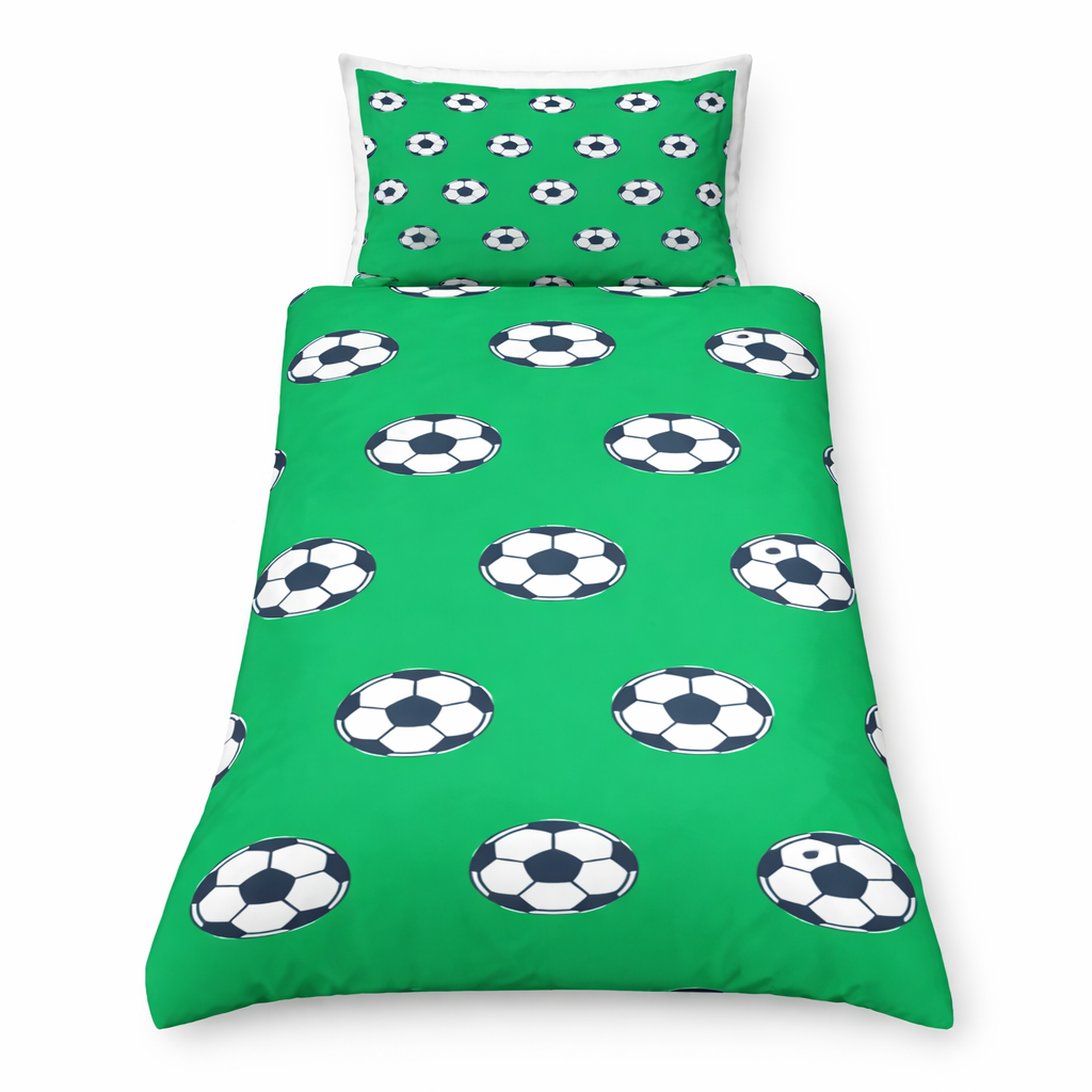 Green bedspread with soccer ball pattern and matching pillowcase on a white background