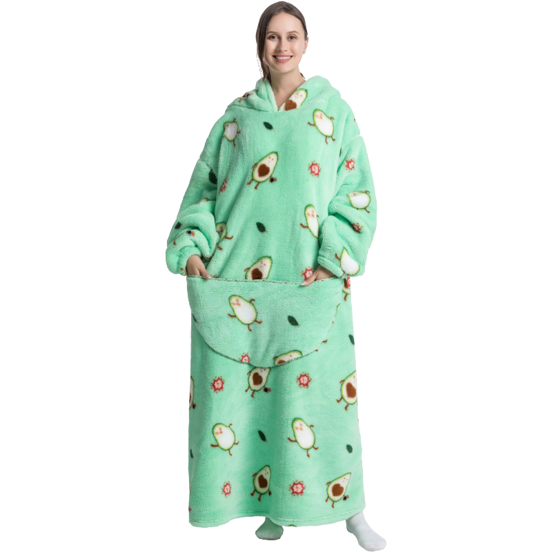 Person wearing a green fleece blanket with avocado pattern on a white background