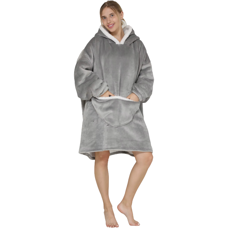 Woman wearing a light grey thick lounge hoodie on a white background