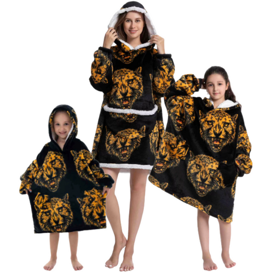 Adult and children wearing black oversized wearable hoodies featuring bold leopard head print and sherpa lining