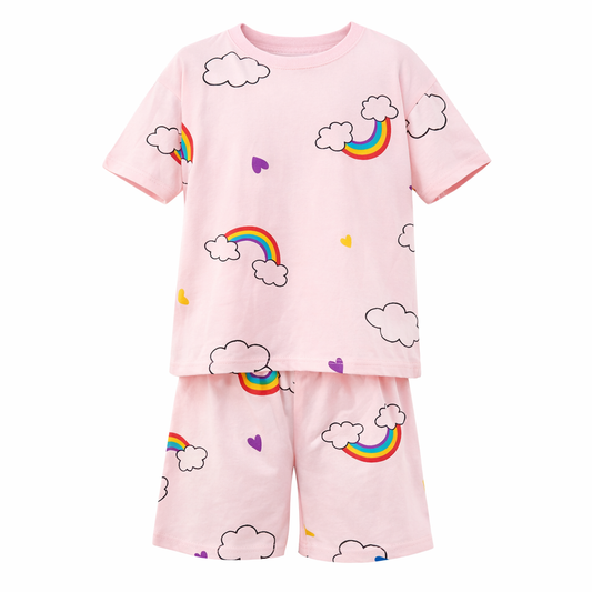 Children's pyjama set with rainbow and cloud patterns on a pink background