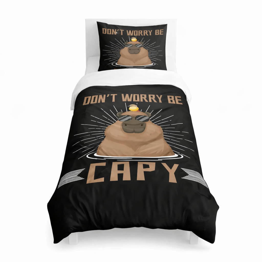 Bedding set with 'Don't Worry Be Capy' design on a black duvet with a white background