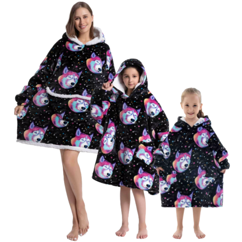 Adult and child wearing black oversized wearable hoodie with colourful wolf head print.