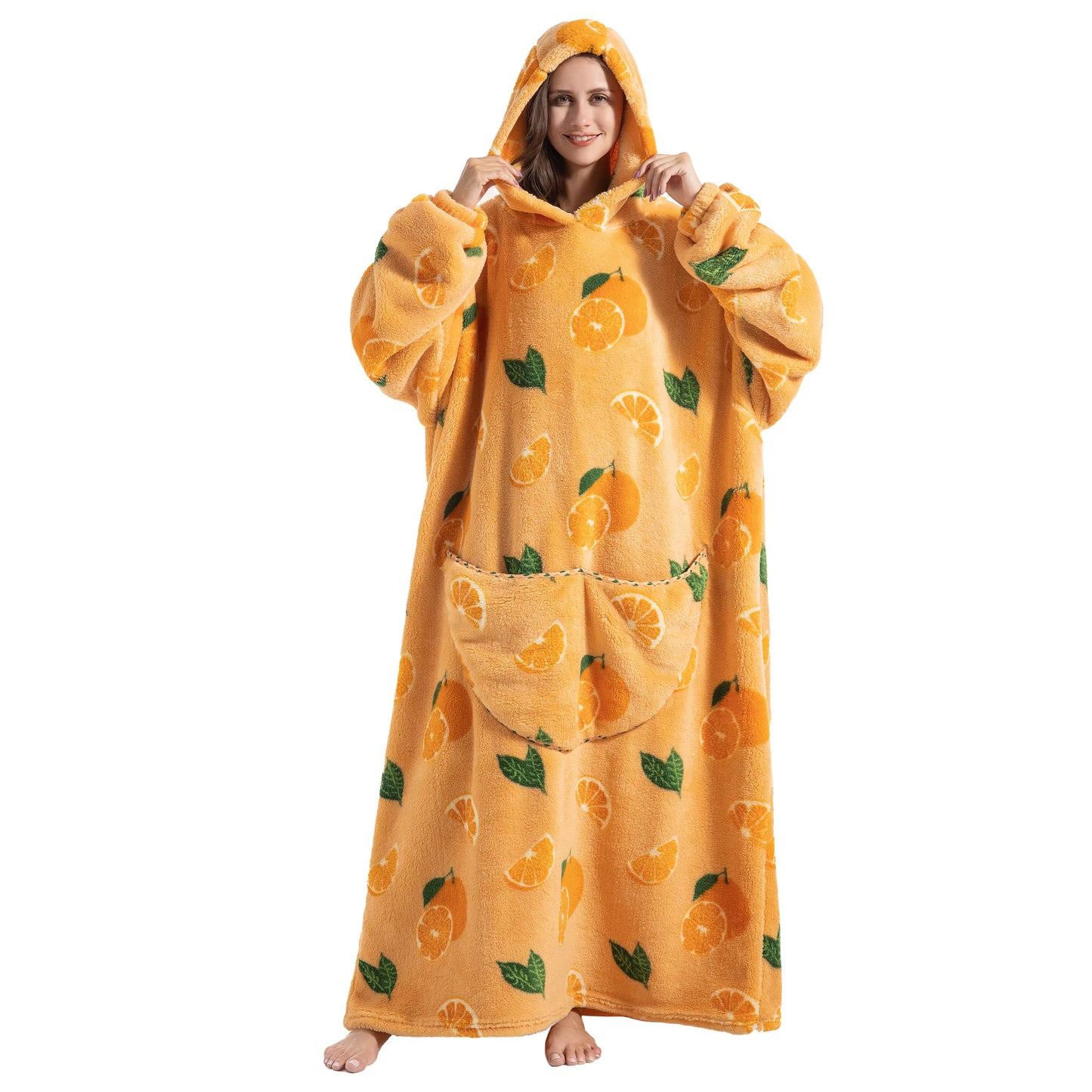 Person wearing a yellow hooded blanket with orange pattern on a white background