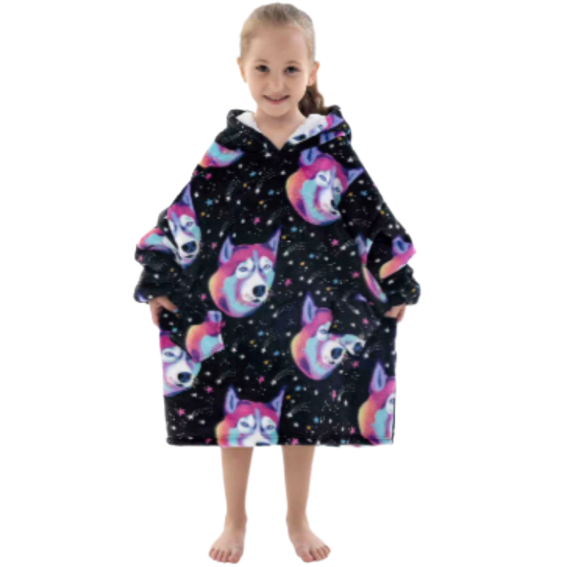 Child wearing black oversized wearable hoodie with colourful wolf head print on a white background.