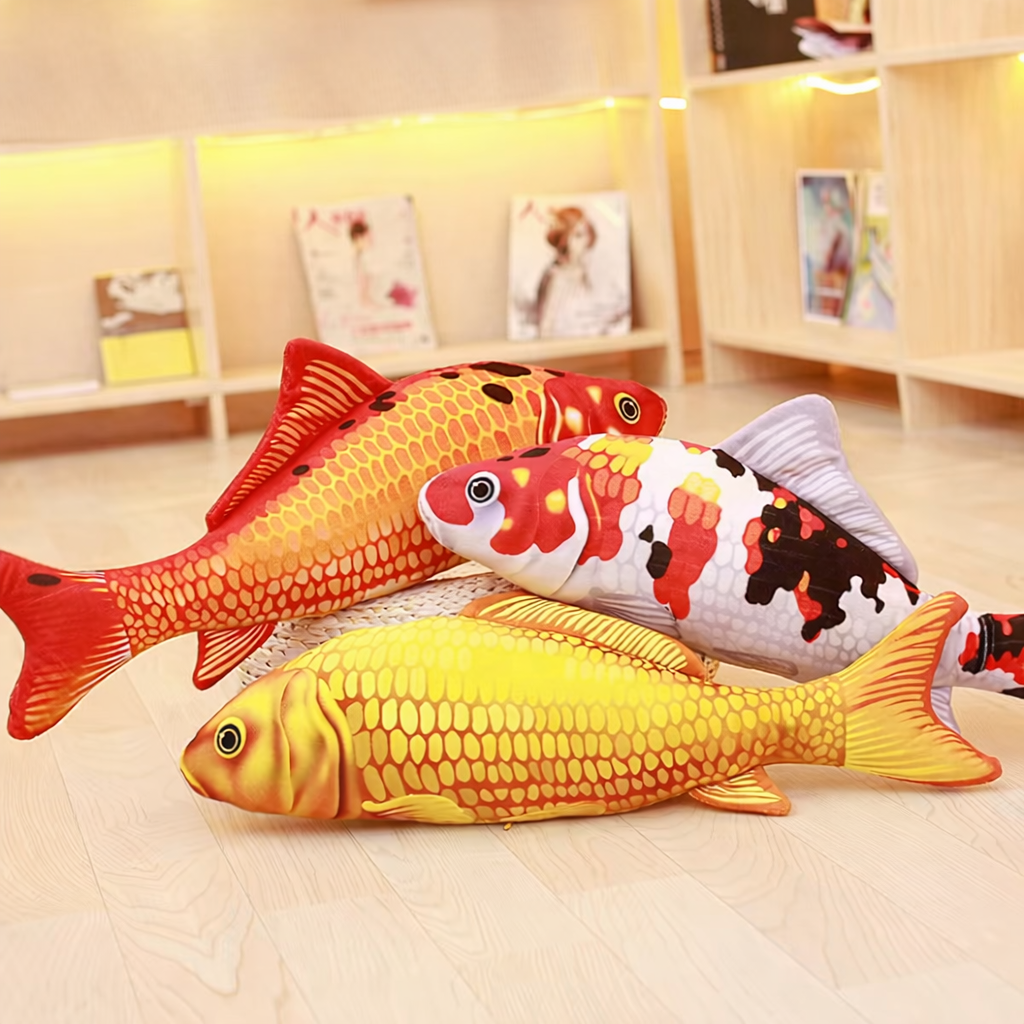 Set of three koi fish soft toys in orange, white and yellow, with detailed scale patterns and realistic printed fins