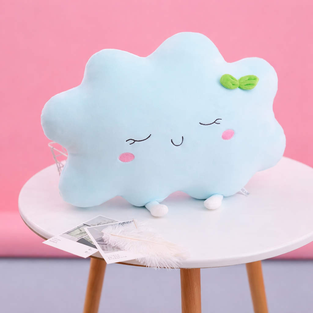 Cute cloud-shaped plush toy with a bow on a white stool against a pink background