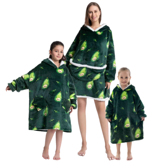 Adult and children wearing green oversized wearable hoodies featuring a playful pear print and soft sherpa lining