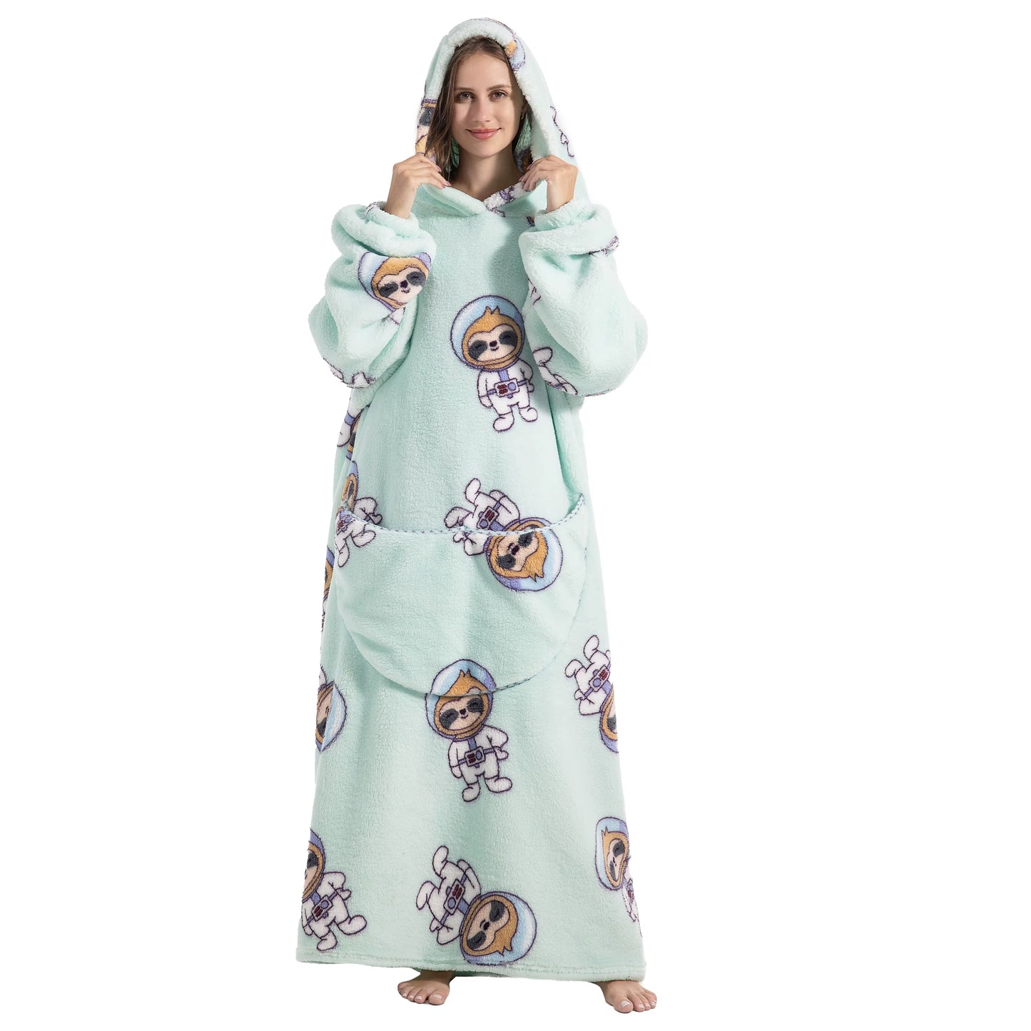 Person wearing a light green onesie with cartoon character prints on a white background