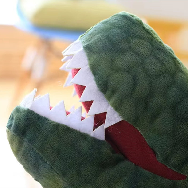 Close up off the mouth of a soft plush t-rex dinosaur toy.