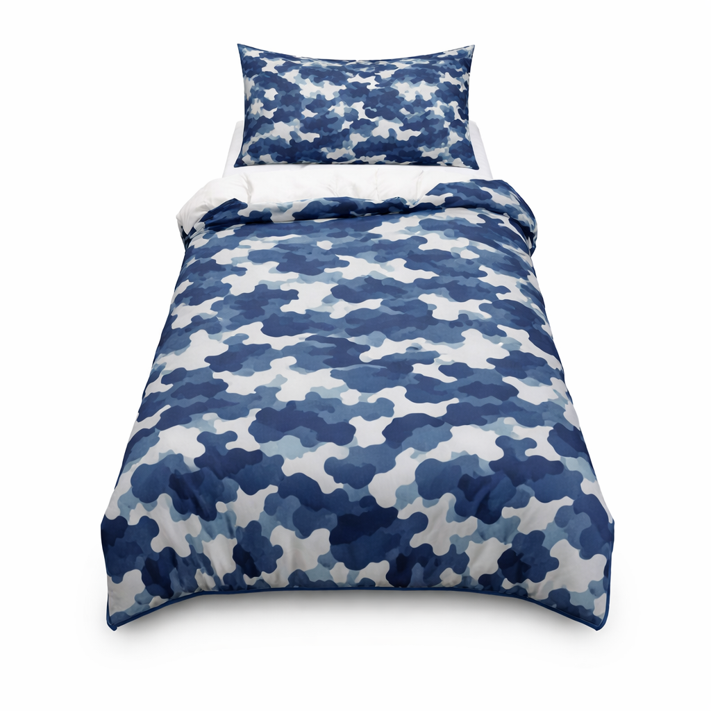 Blue and white camouflage bedspread with matching pillow on a white background