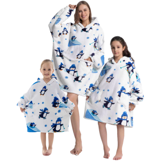 Adult and two children wearing white penguin oversized wearable hoodies