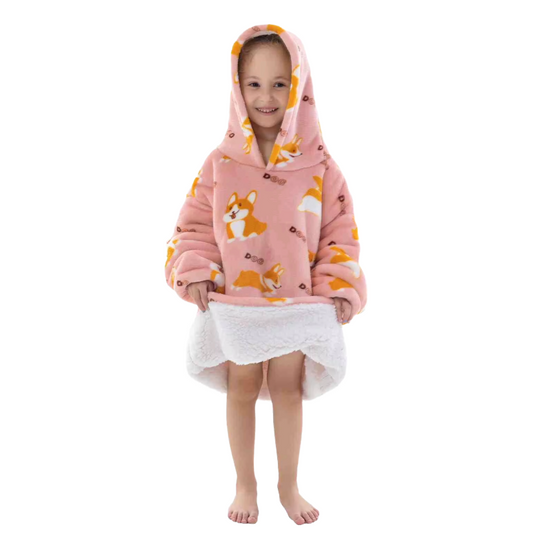Child wearing a pink corgi design oversized lounge hoodie with a white background.