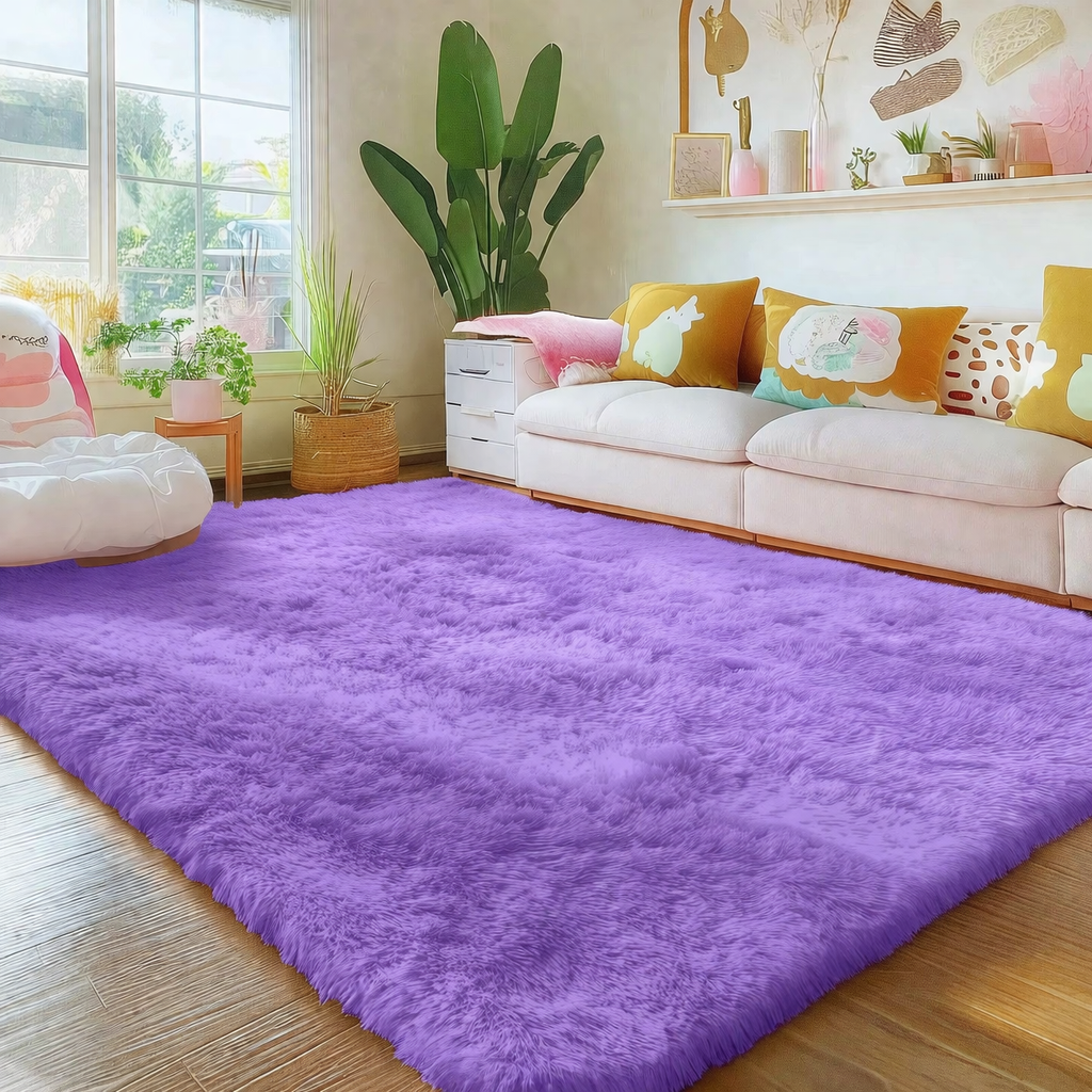 Living room with a purple rug, white sofa, and colorful cushions.