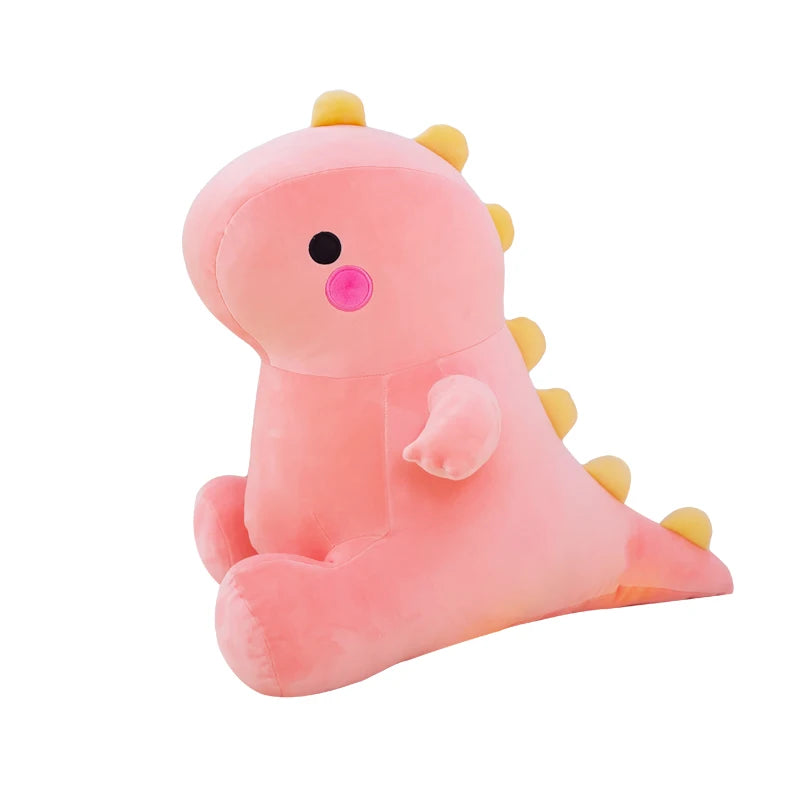 Pink plush toy with yellow spikes on a white background