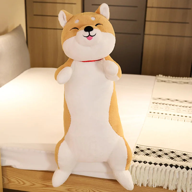 Plush toy shaped like a dog on a bed
