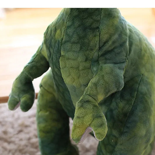 Close up off the arms of a soft plush t-rex dinosaur toy.