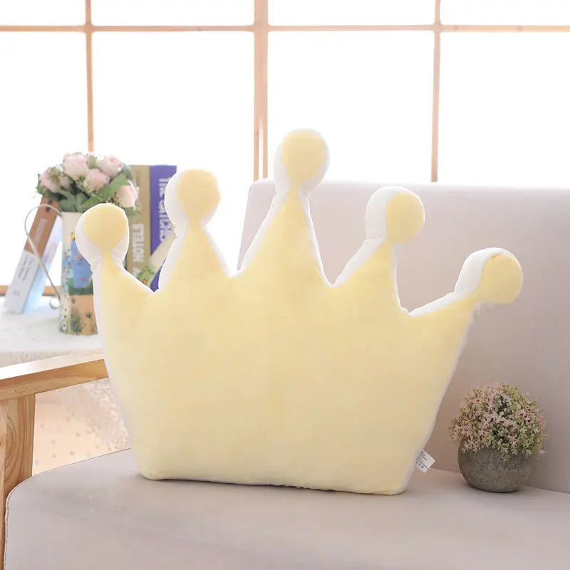 Yellow plush crown pillow showing a wider crown shape with soft plush texture