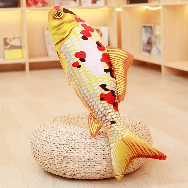 White koi fish soft toy with orange, black and yellow markings, displayed upright on a round woven stand