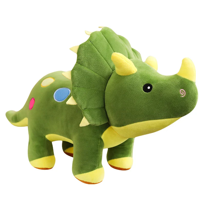 Green plush dinosaur toy with yellow accents on a white background