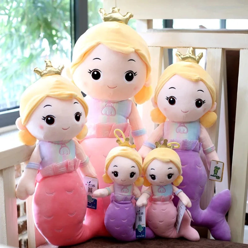 Set of plush toys resembling princess mermaids with different colours and poses.