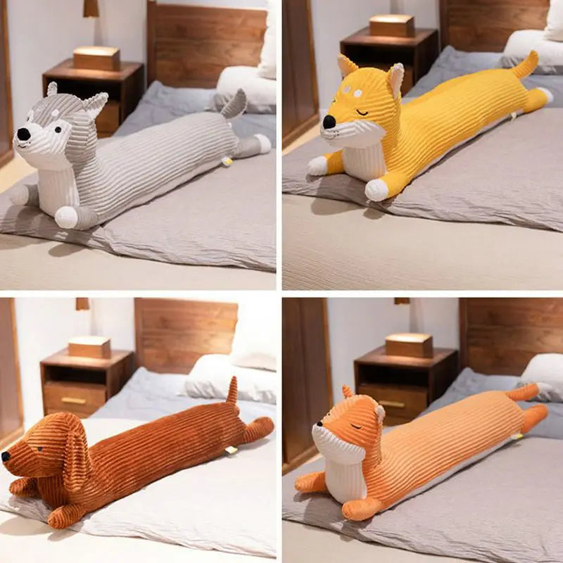 Four animal-shaped body pillows on a bed in a bedroom setting.
