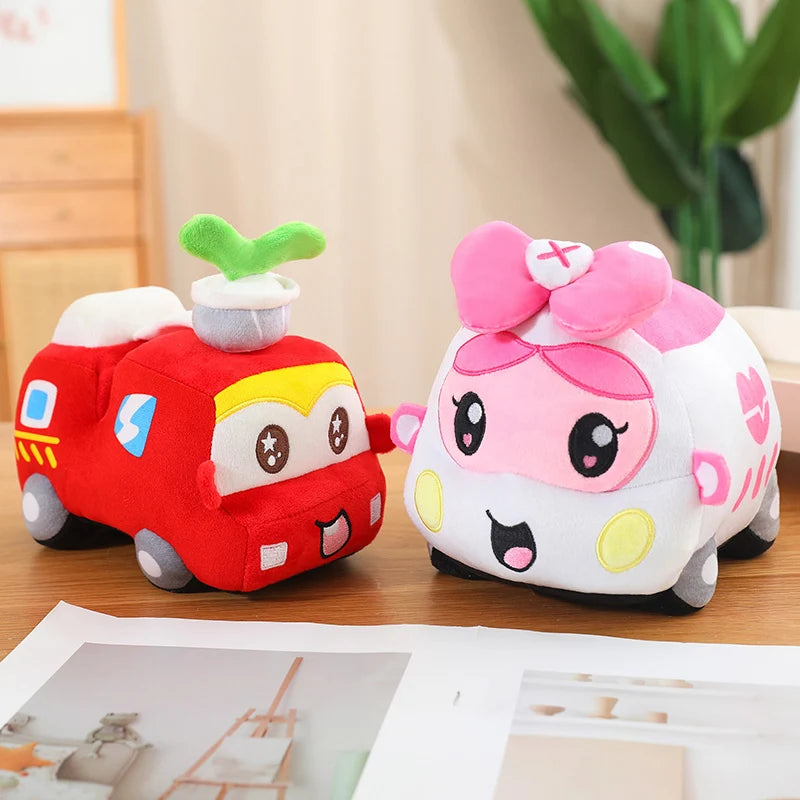 Two cartoon-style plush toys, one red and one pink with a nurse hat, on a wooden surface.