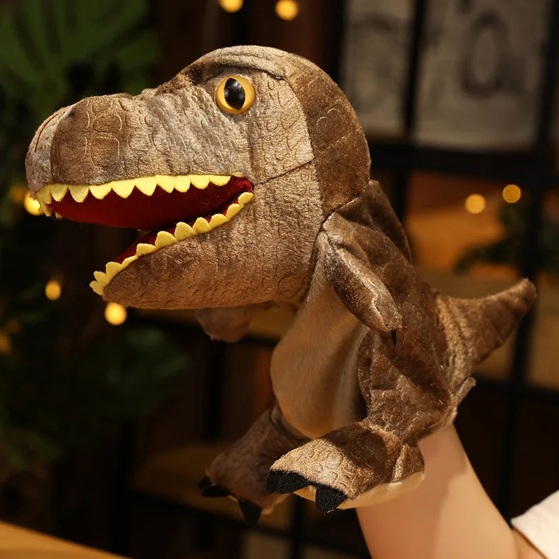Plush brown dinosaur hand puppet held by a person against a blurred indoor background