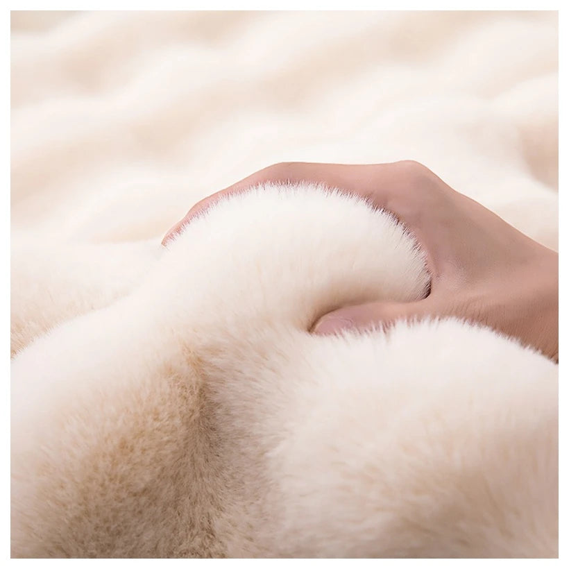 A hand holding a bubble from the bubble rug