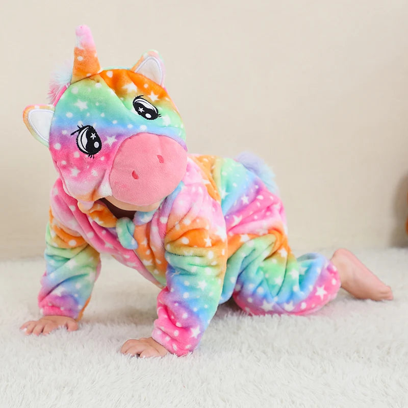 Child wearing rainbow unicorn baby romper with hooded design and zip front in soft flannel fabric