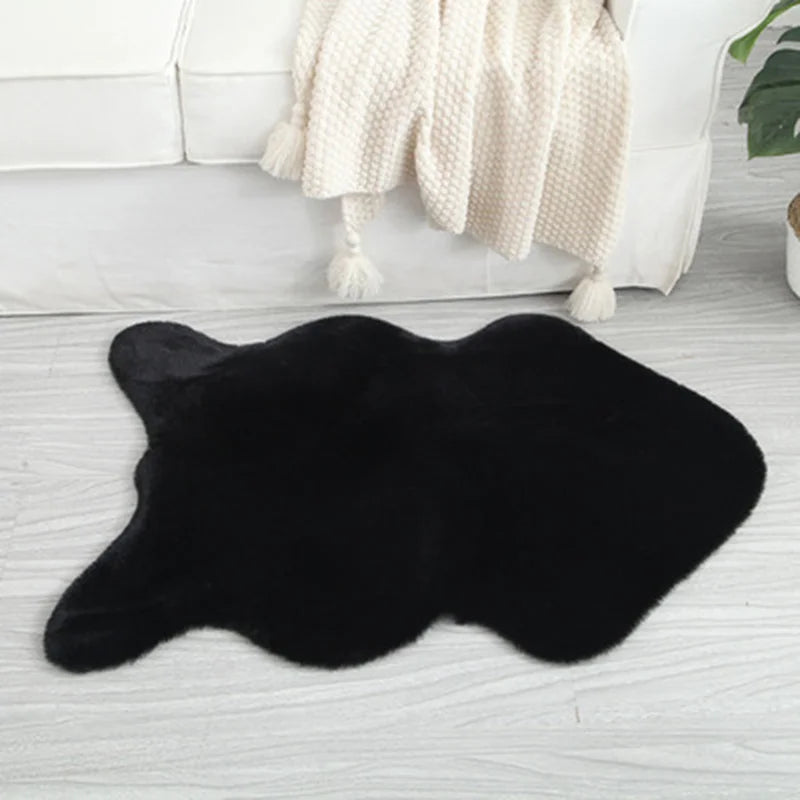 Black fun-shaped faux rabbit fur rug placed on a light floor beside a chair