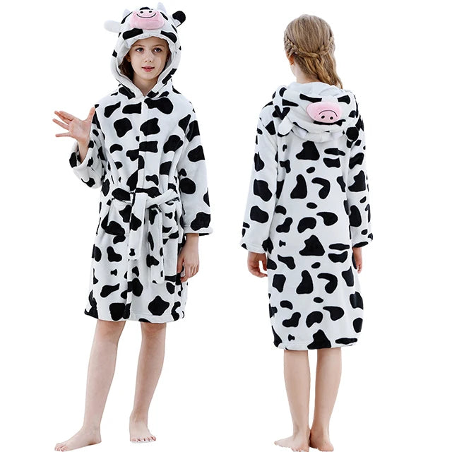 Cow-themed robe worn by a child on a white background