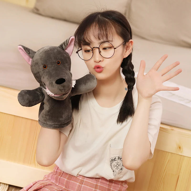Young girl holding a plush animal puppet toy in a casual indoor setting