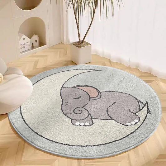 Beige round cartoon rug with grey elephant design placed on a light floor in a nursery setting
