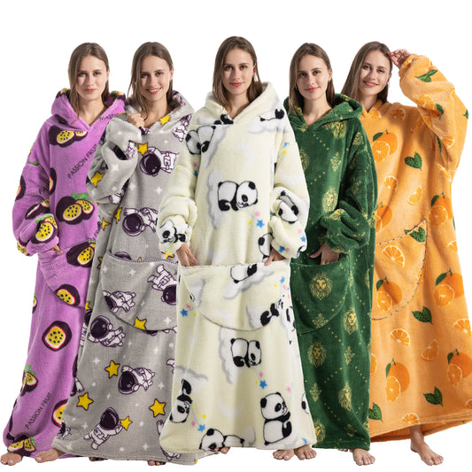 Five women wearing colorful hooded blankets with various patterns.