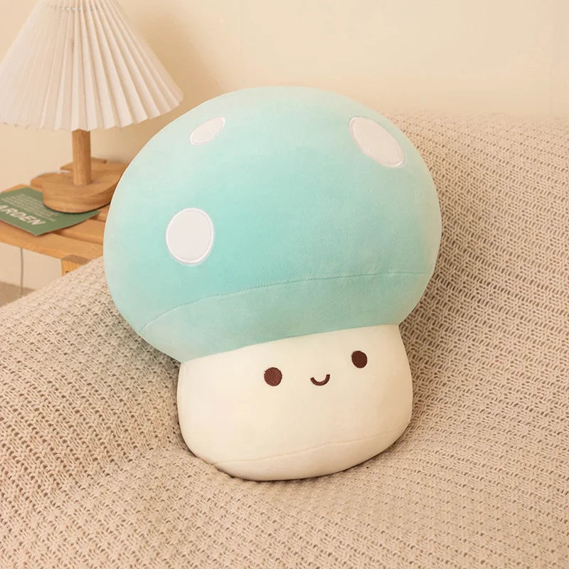 Pastel blue soft plush mushroom toy on a soft surface.