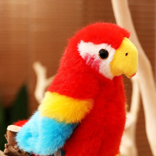 Close up of a red soft plush parrot with a blurred background