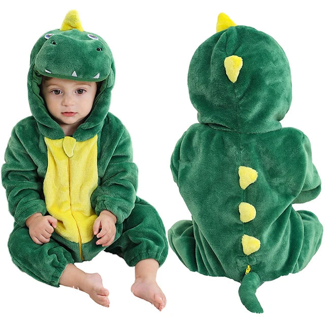 Child wearing a green dinosaur onesie with yellow accents on a white background