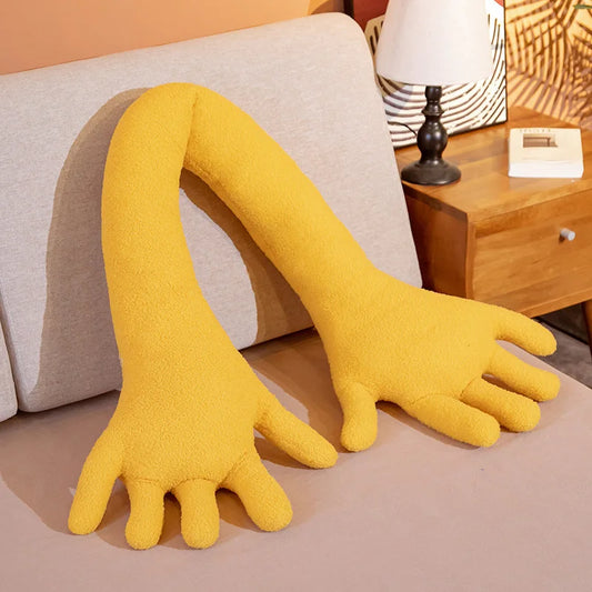 Yellow soft plush simulation hand on a couch.